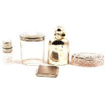 A silver hip flask, salts bottle, two glass pots with silver covers.