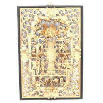 A Japanese ornately carved and gilded framed panel.
