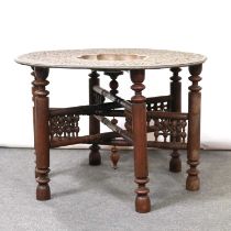 Indian brass tray top table on ornate folding stand,