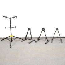 Hercules double guitar stand and other single guitar stands.