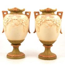 A pair of Royal Dux Art Nouveau style twin handled urn shaped vases.