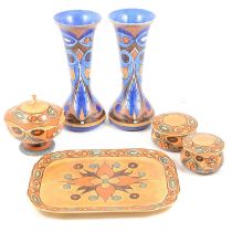 Pair of Chameleon Ware vases, and a four-piece dressing table set