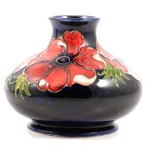 A Moorcroft vase in the Anemone design.