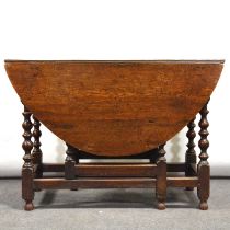 Old oak gateleg table, and six ladderback chairs,