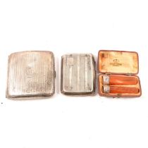 Two silver cigarette cases and a pair of amber cigar and cheroot holders.