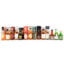 Fourteen bottles of single malt whisky miniatures, mostly in tubes/ cartons