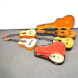 BM Concert acoustic guitar, three other acoustic guitars and a mandolin.