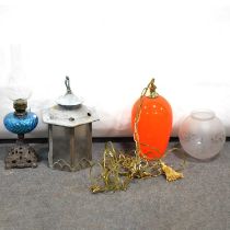 Vintage orange glass lamp shade, an oil lamp, and a hall lantern