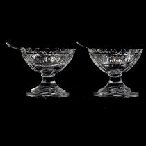 Pair of cut glass salts, with silver salt spoons