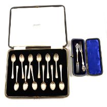 Set of twelve silver egg spoons; a pair of silver pickle forks,