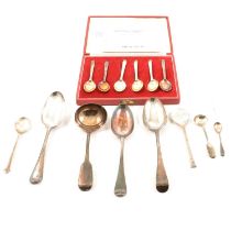 Three Georgian table spoons, sauce ladle and four other spoons.