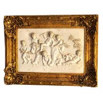 Two marble-effect composite relief panels in gilt frames
