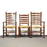 Set of four ladderback dining chairs, including two armchairs