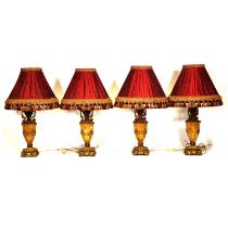 Set of four gilt composition table lamps,