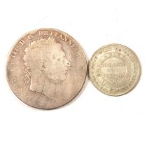 A George III silver crown and a Lincoln Silver Token.