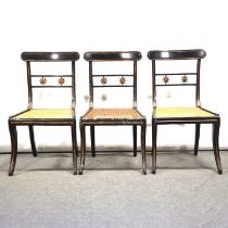 Three ebonised side chairs, 19th century,