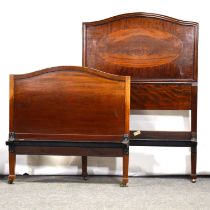 Edwardian mahogany wardrobe and a pair of single bed frames,