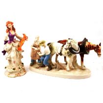 Continental porcelain group of farriers and shire horses, pair of bisque figures, cat and donkey.