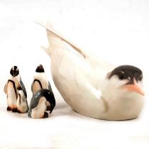 Royal Copenhagen Squatting Tern and Royal Doulton miniature penguins.