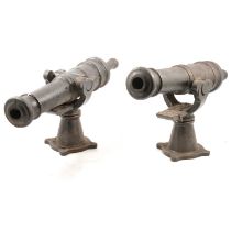 Two table-top cast iron cannons