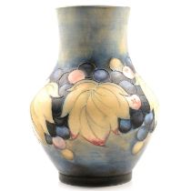 A William Moorcroft salt glazed vase in the Leaf and Berries design.