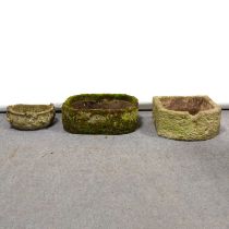 Stone bowfront sink and two small stone planters.