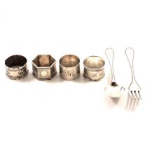 Four silver napkin rings and a Victorian silver bead edge fork and spoon.