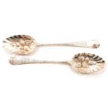 Matched pair of Georgian silver berry spoons, William Eley I & William Fearn, London 1803 and 1804.