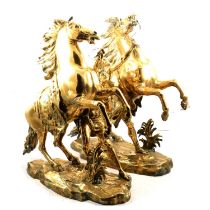 After Coustou, pair of large brass Marly horses,