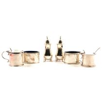 Two silver mustard pots and a pair of silver salts, two pepper pots.,