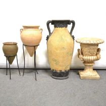 Two Greek style terracotta vases on stands and two urns.
