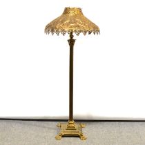 Brass standard lamp with pierced metal shade,