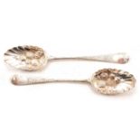 Two Georgian silver berry spoons, indistinct maker's marks, London 1799 and 1805.