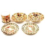 Six Royal Crown Derby Imari pattern plates, two bowls and a cylindrical pot.