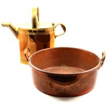 Copper jam pan and a brass watering can.