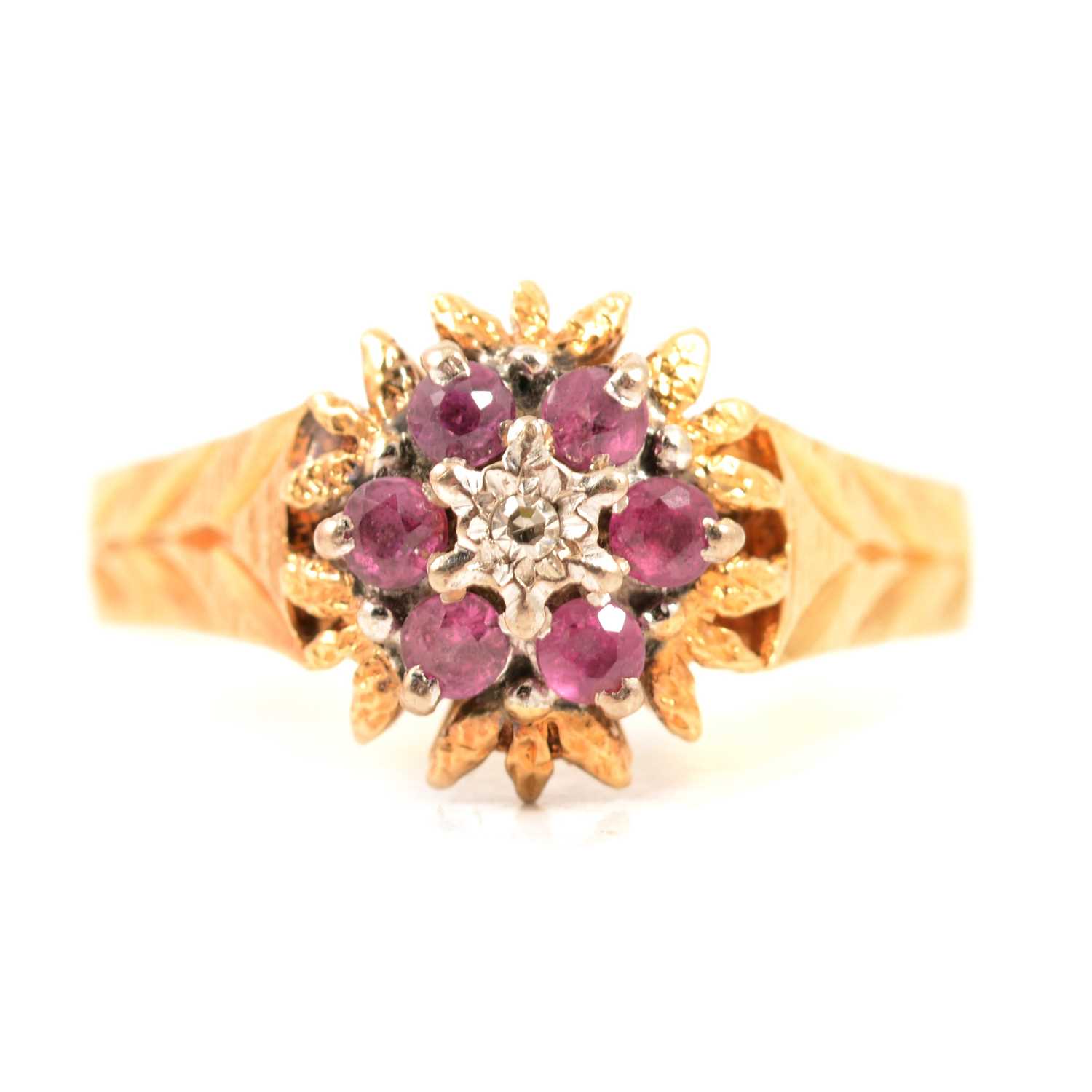A ruby and diamond reverse cluster ring.