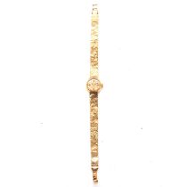 Omega - a lady's 9 carat yellow gold bracelet wristwatch.