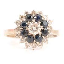 A 1970's sapphire and diamond reverse cluster ring.