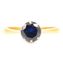 A synthetic sapphire solitaire ring.