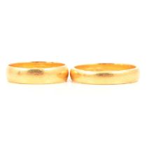 Two 22 carat gold wedding bands.