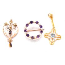 An amethyst and pearl brooch and two pendants.