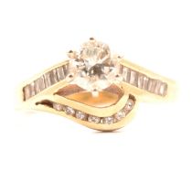 A diamond solitaire ring.