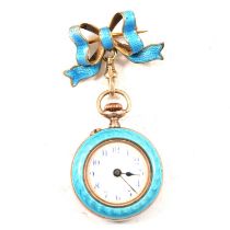 A small gilt white metal and enamel fob watch and bow.