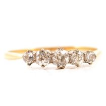 A diamond five stone half hoop ring.