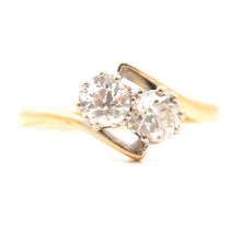 A diamond two stone crossover ring.