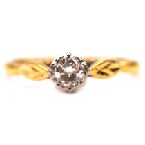 A diamond solitaire ring.