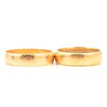 Two 18 carat yellow gold wedding bands.