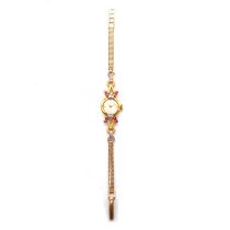 Girard Perregaux - a lady's 18 carat yellow gold, ruby and diamond cocktail wristwatch.