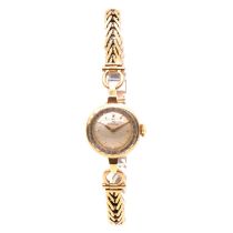 Omega - a lady's 9 carat yellow gold bracelet wristwatch.