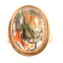 A moss agate dress ring.